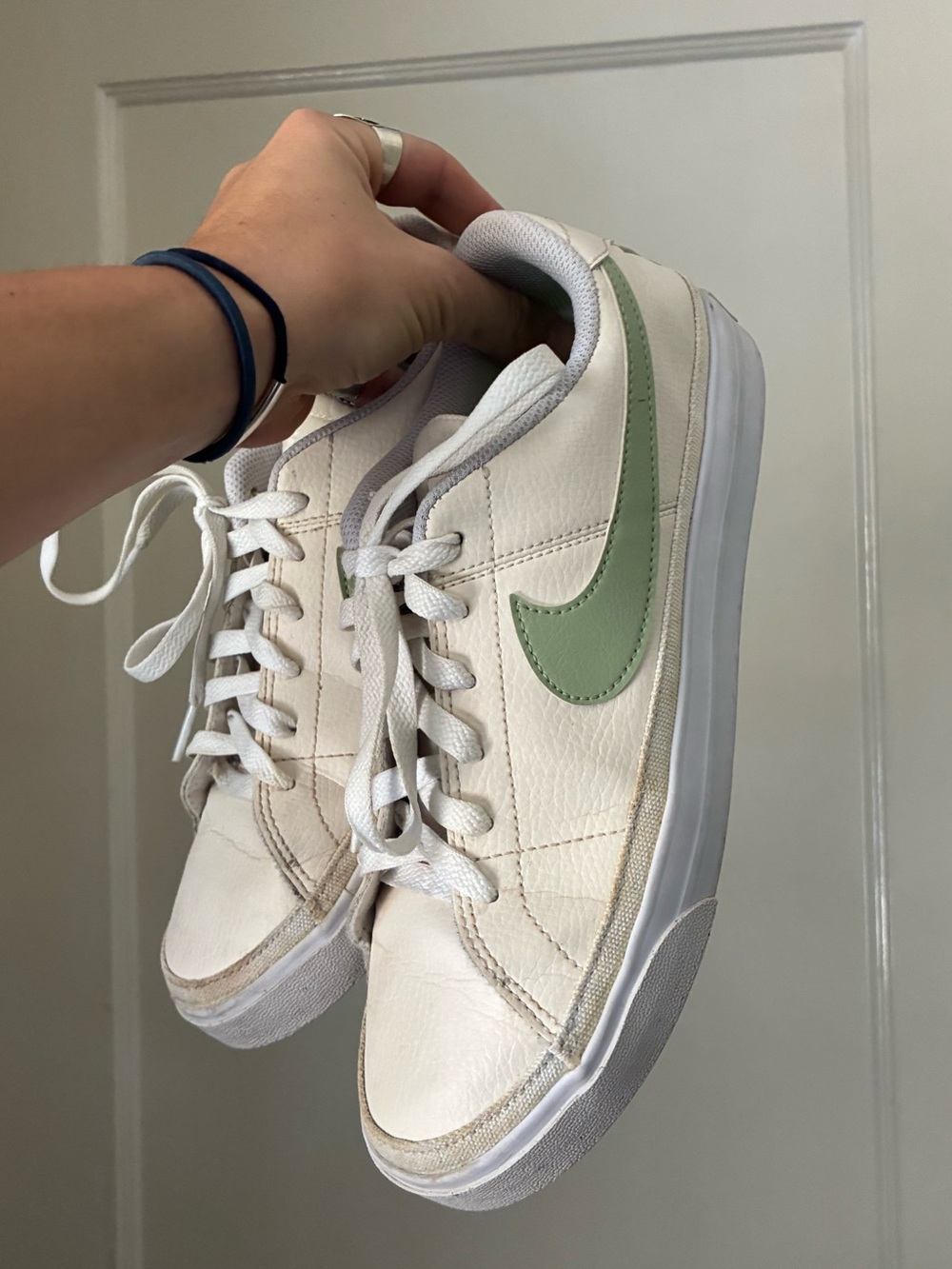 Nike White Low-Top Sneakers with Light Green Swoosh